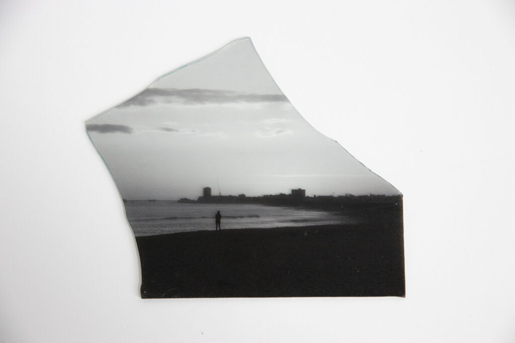 photo of shoreham beach point towards worthing, placed on a piece of glass, monochrome, ocean, landscape